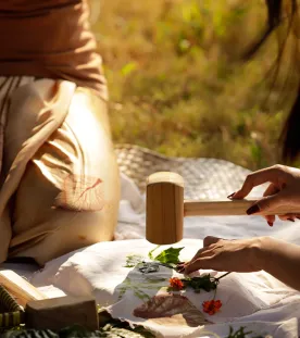 eco-pounding workshop person hitting a flower with a mallet